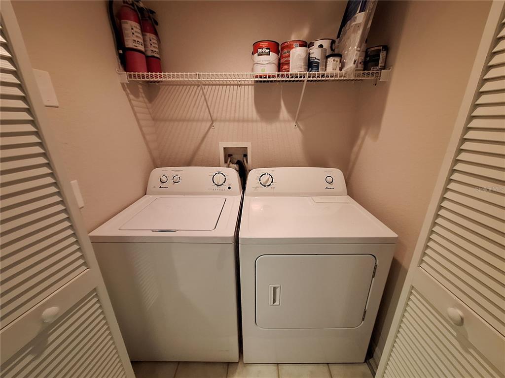5550 Rosehill Road, Unit 103 Sarasota, FL 34233 - Photo 16 of 28 a utility room with dryer and washer