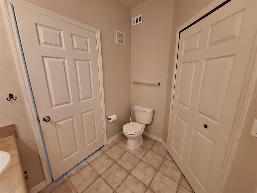 5550 Rosehill Road, Unit 103 Sarasota, FL 34233 - Photo 20 of 28 a bathroom with a toilet and a shower