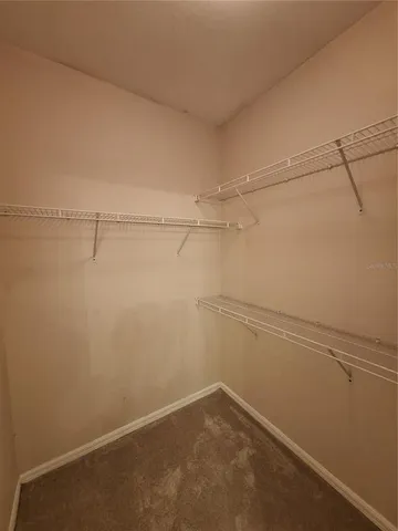 a view of a room with racks on the wall