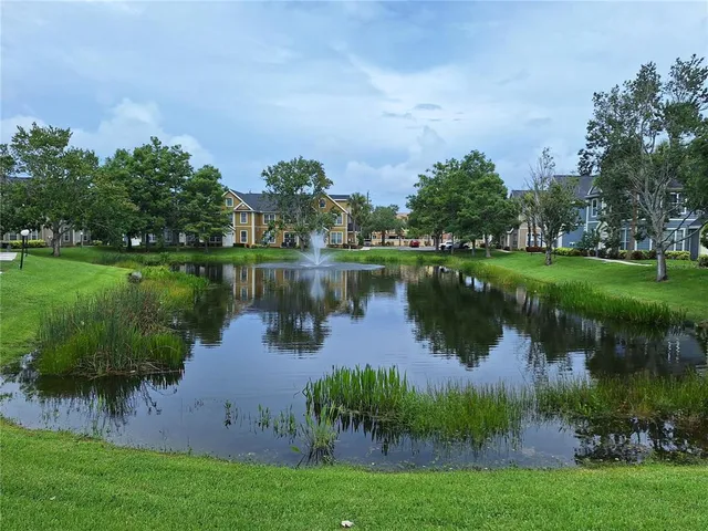 a view of a lake with houses in the back
