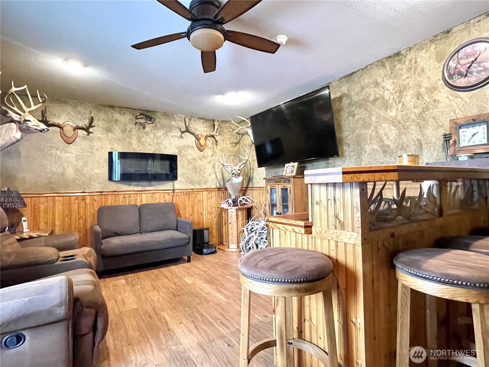 1180 4th Avenue North Okanogan, WA 98840 - Photo 13 of 40 a living room with furniture and a flat screen tv