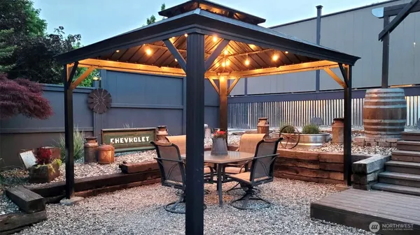 a view of outdoor space with wooden floor and seating