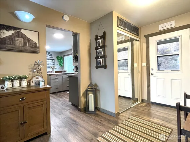 a view of a double vanity sink and a window