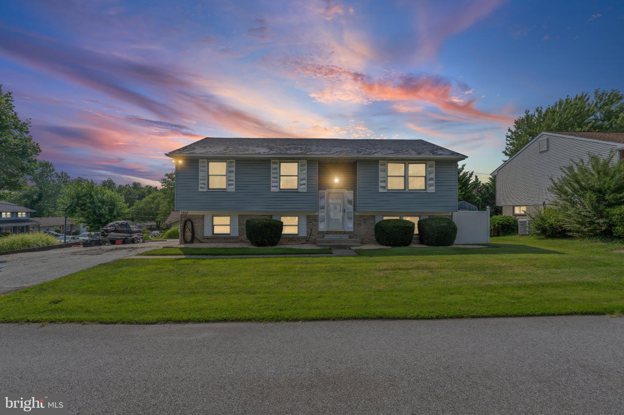 1317 Roxboro Road Baltimore, MD 21237 - Photo 1 of 30 Charming home under a vibrant sky.