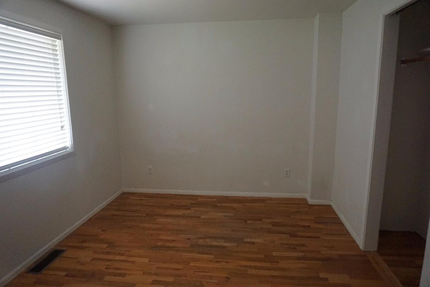 1312 Talent Avenue Talent, OR 97540 - Photo 12 of 21 a view of a room with wooden floor and a window