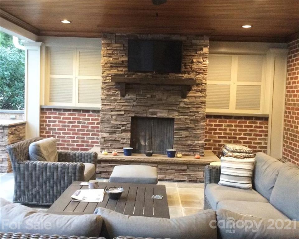 1600 Windy Ridge Road Charlotte, NC 28270 - Photo 5 of 9 a living room with furniture and a fireplace