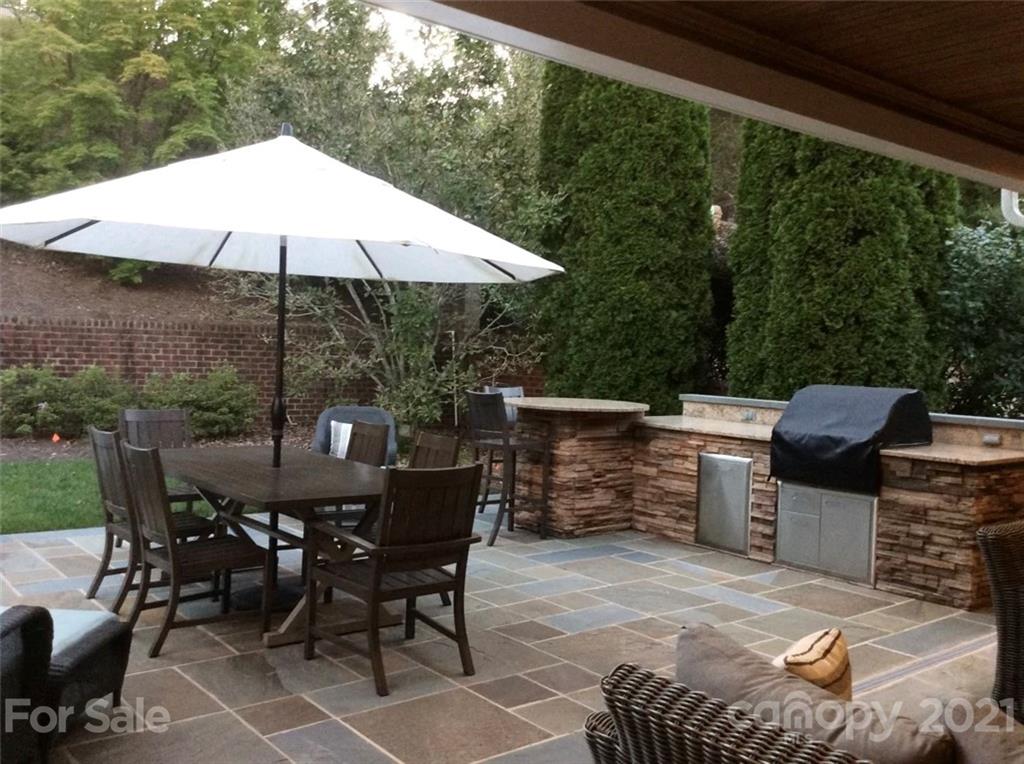 1600 Windy Ridge Road Charlotte, NC 28270 - Photo 8 of 9 a view of backyard with outdoor seating and trees