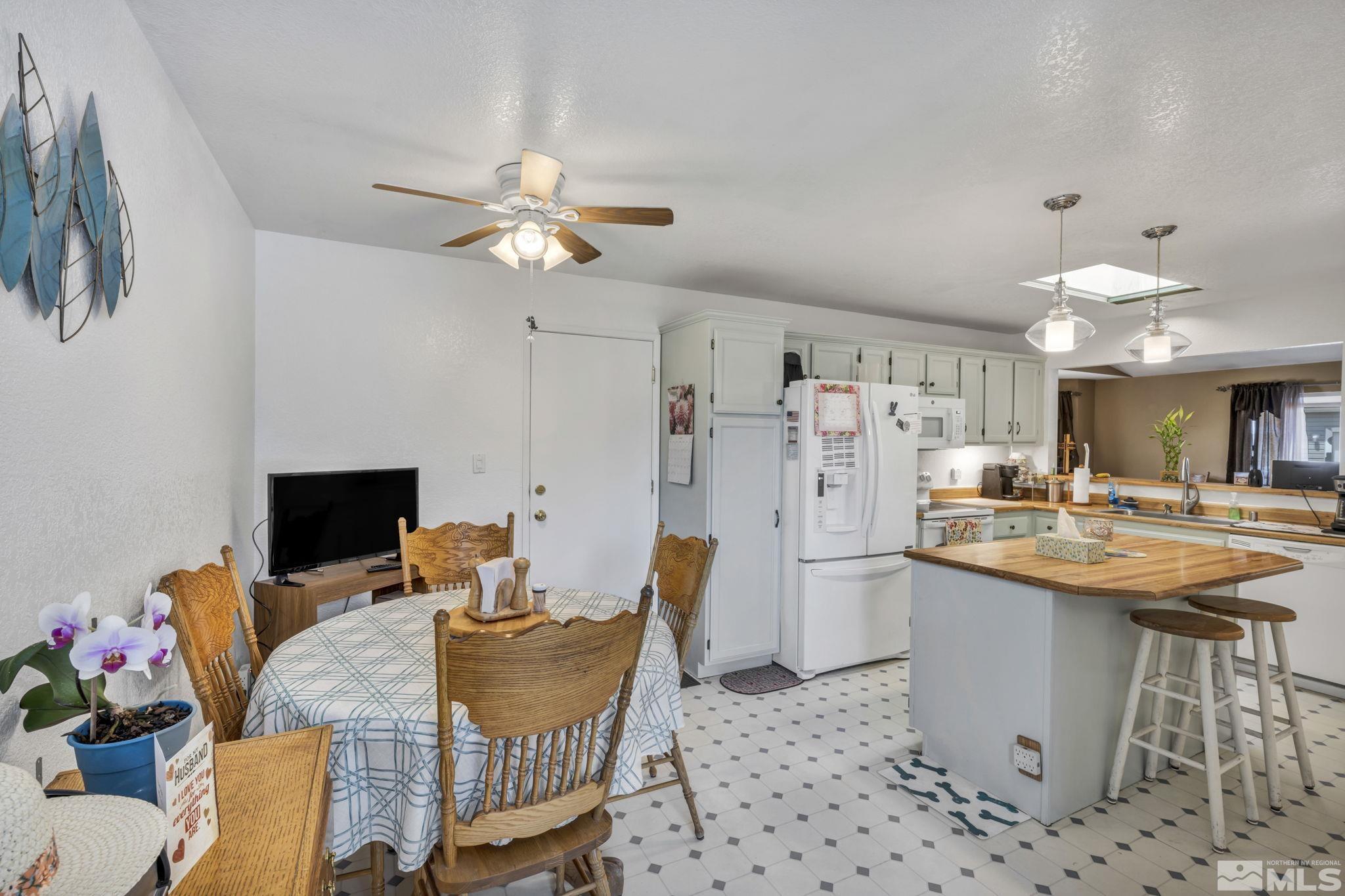 17575 Blackbird Drive Reno, NV 89508 - Photo 13 of 29 a dining room with furniture and a kitchen