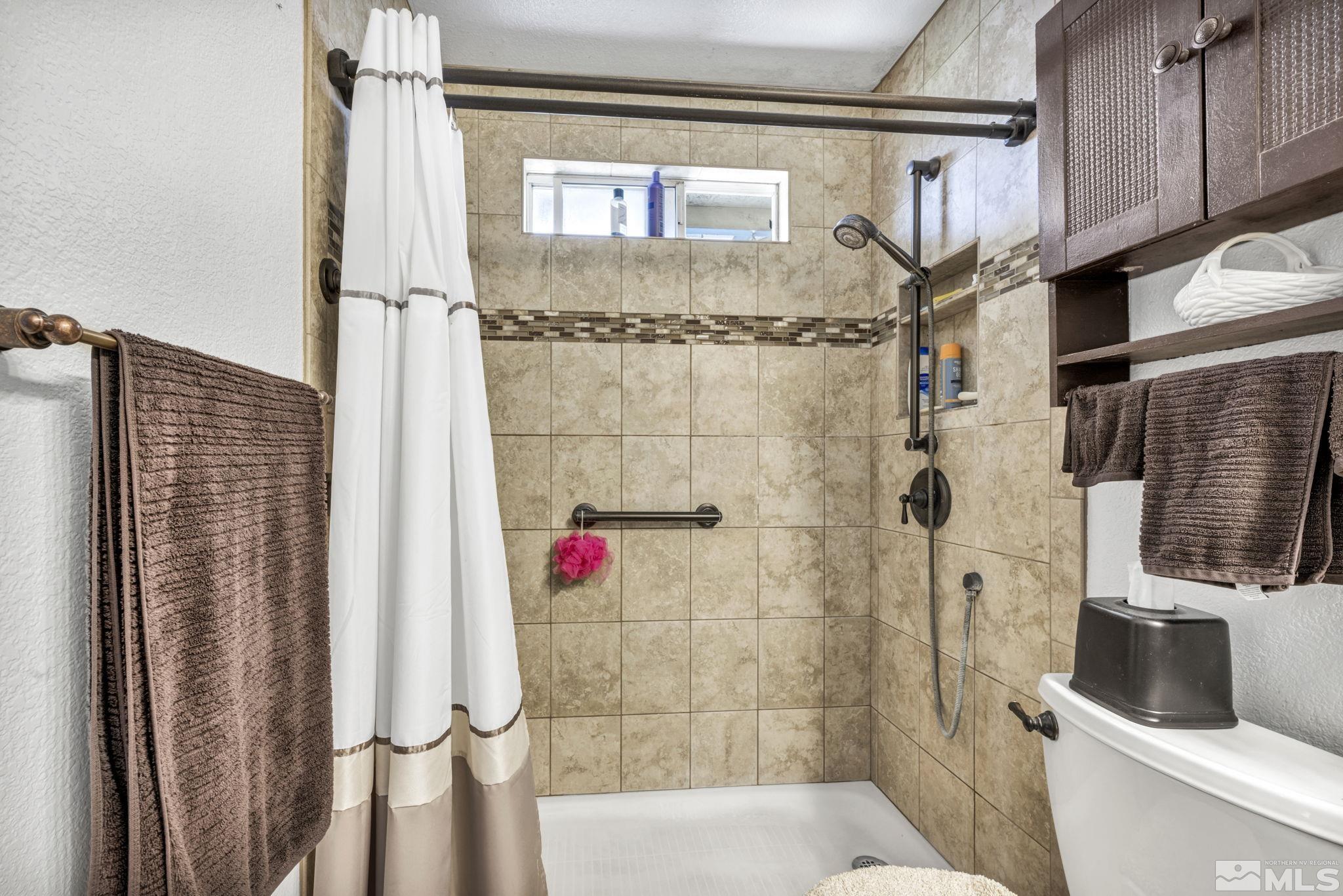 17575 Blackbird Drive Reno, NV 89508 - Photo 18 of 29 a bathroom with a shower and a toilet