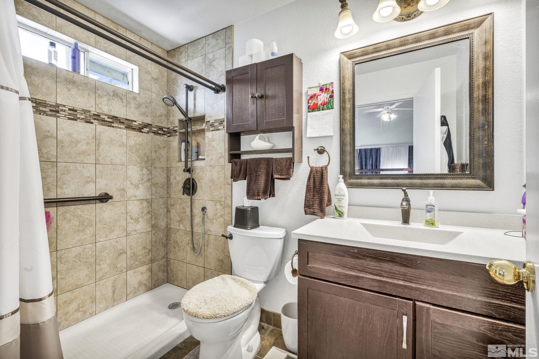 17575 Blackbird Drive Reno, NV 89508 - Photo 19 of 29 a bathroom with a sink toilet and shower