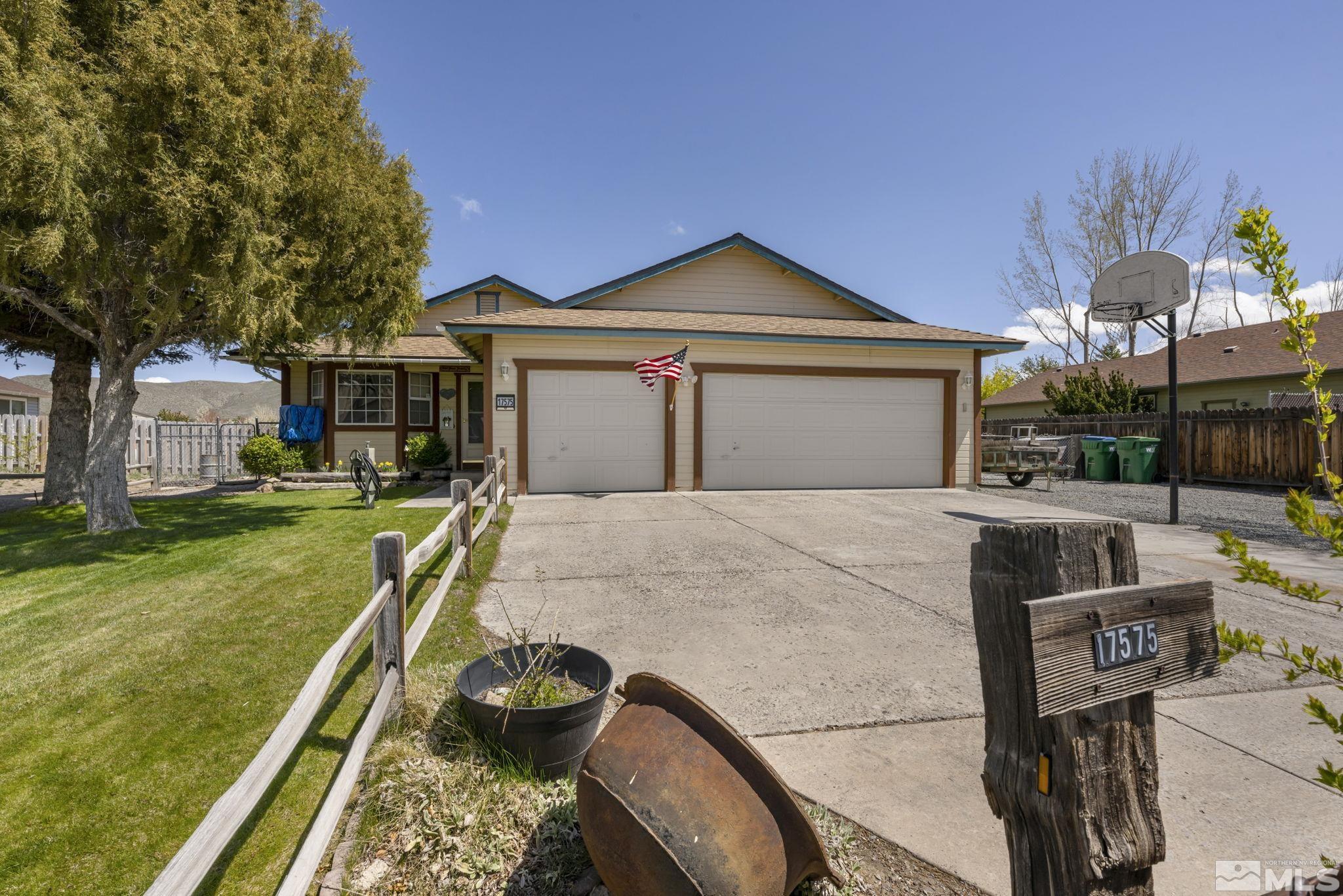 17575 Blackbird Drive Reno, NV 89508 - Photo 2 of 29 a front view of a house with garden