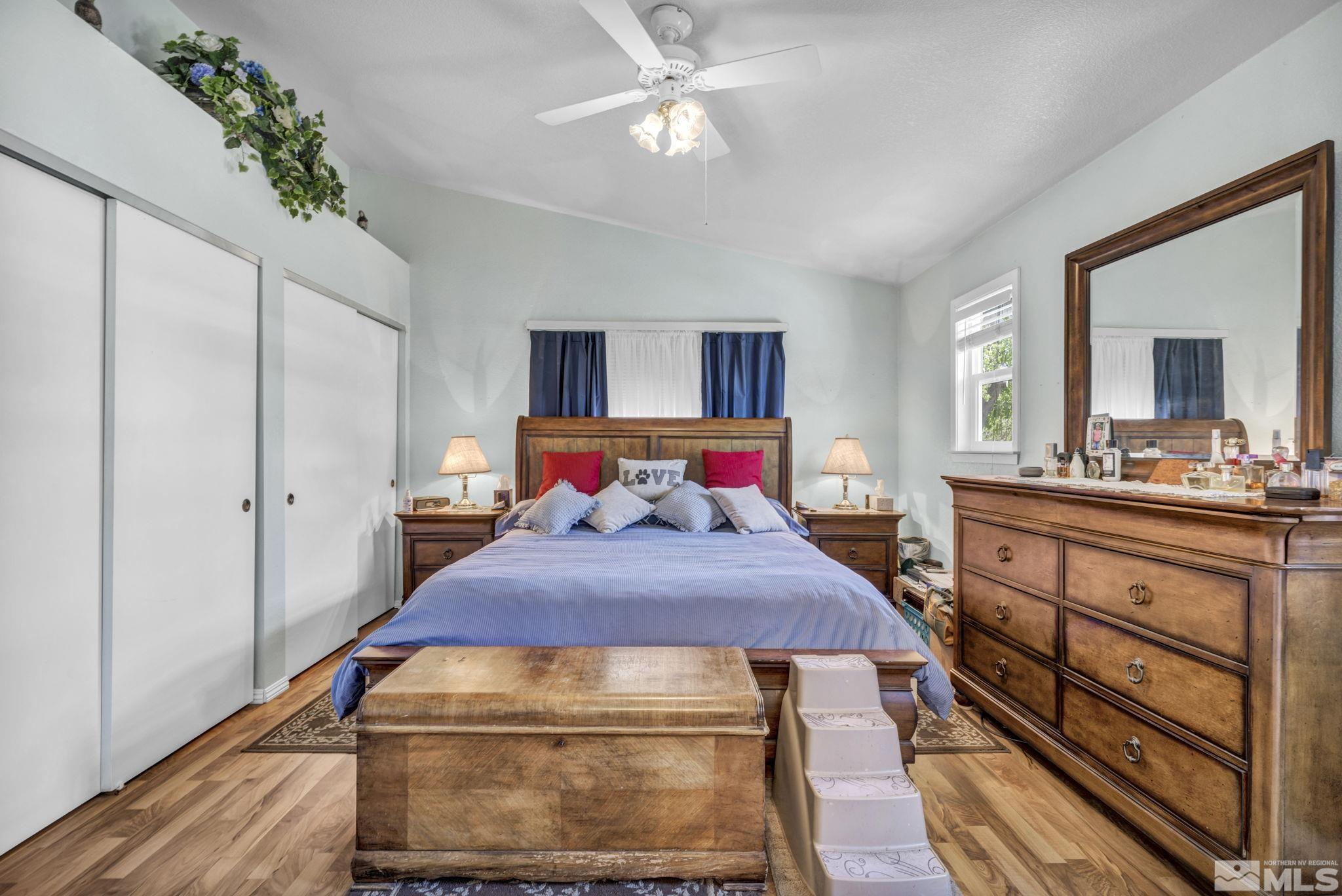 17575 Blackbird Drive Reno, NV 89508 - Photo 22 of 29 a bedroom with a bed and a chandelier