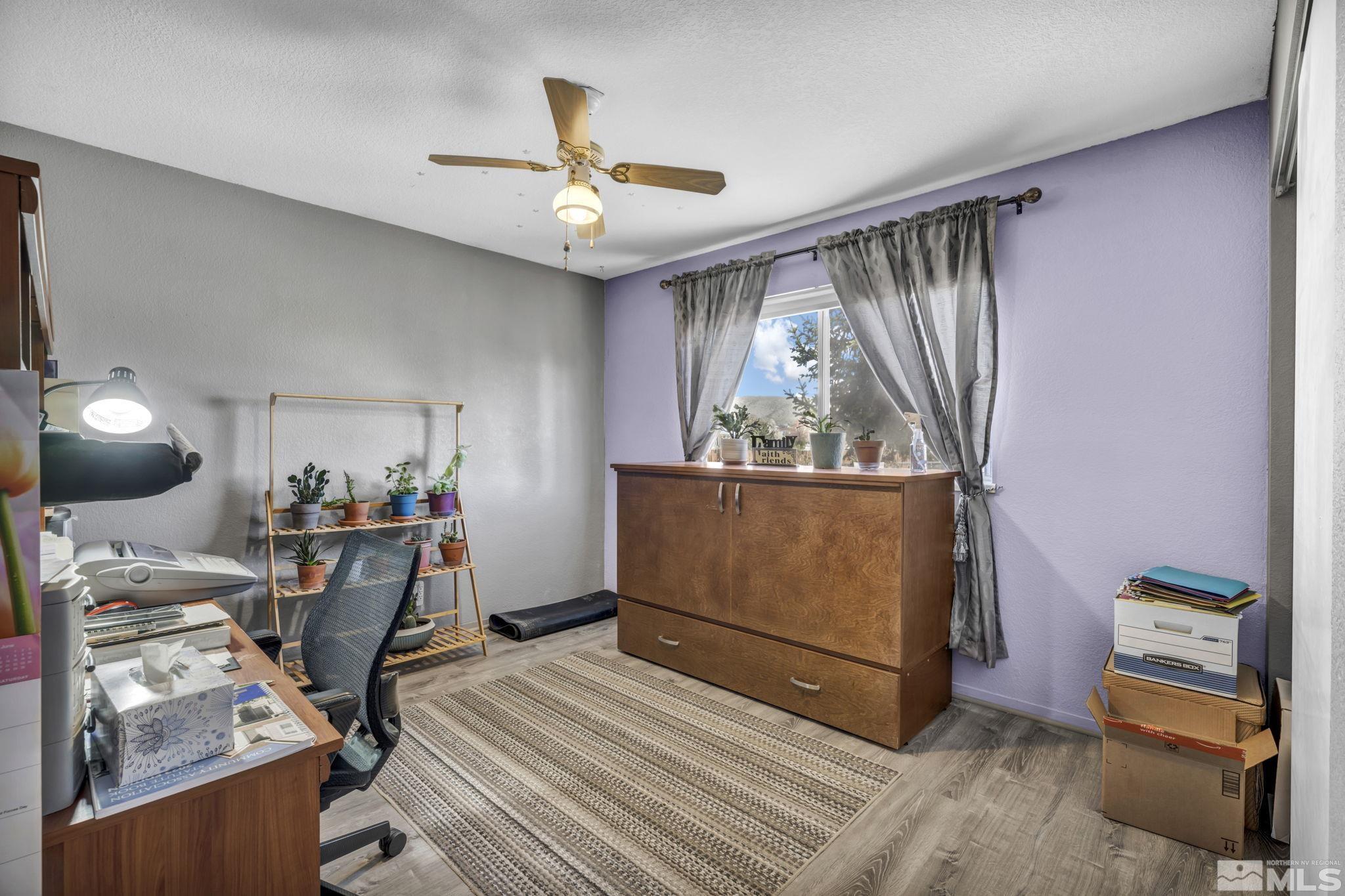 17575 Blackbird Drive Reno, NV 89508 - Photo 26 of 29 a view of a workspace with furniture and a window