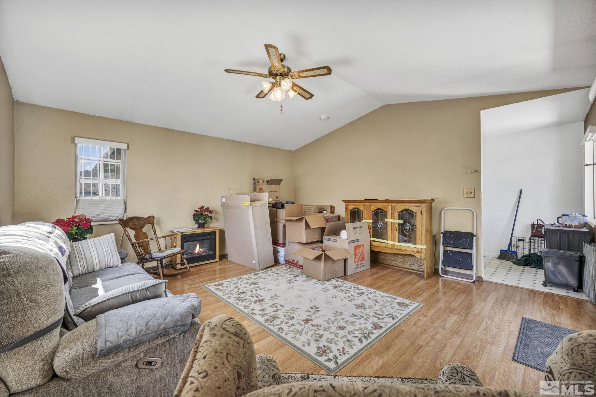 17575 Blackbird Drive Reno, NV 89508 - Photo 29 of 29 a living room with furniture and a wooden floor