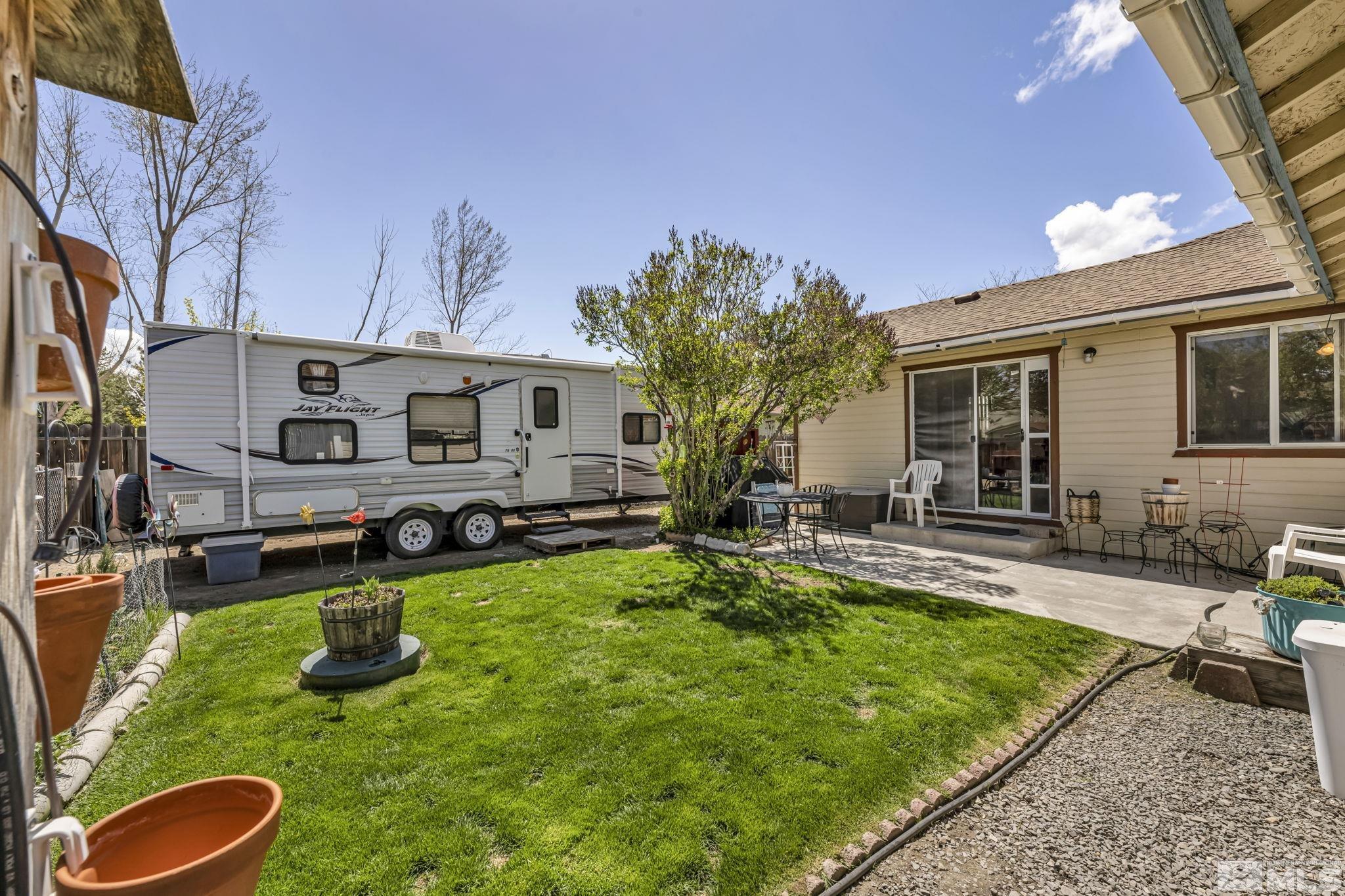 17575 Blackbird Drive Reno, NV 89508 - Photo 7 of 29 a view of a house with backyard sitting area and swimming pool