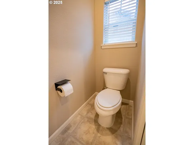a bathroom with a toilet and a sink