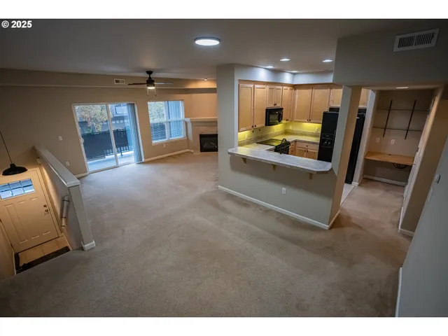 a view of living room with furniture and a window