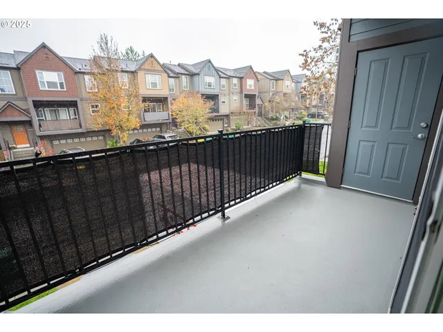 a view of a balcony with city view