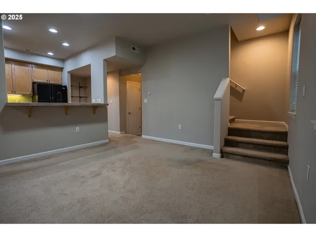 a view of entryway and kitchen