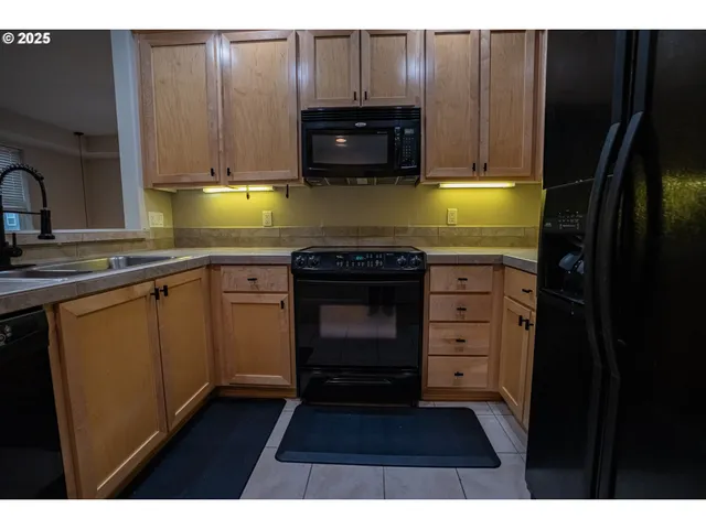 a kitchen with a stove and a microwave