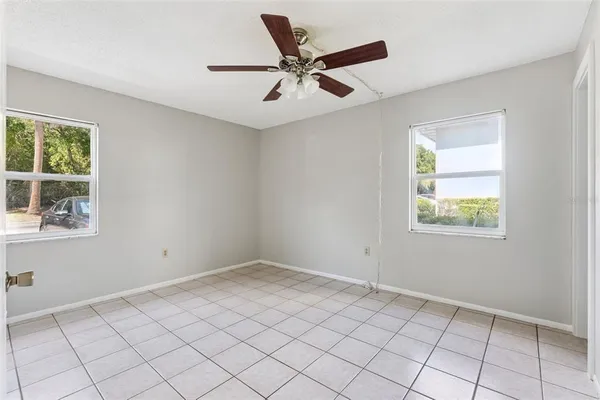 a view of an empty room with a window