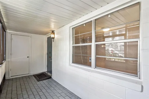 a view of empty room with windows