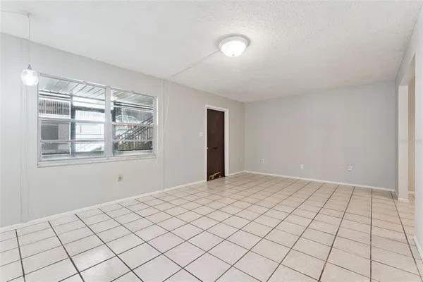 a view of an empty room and window