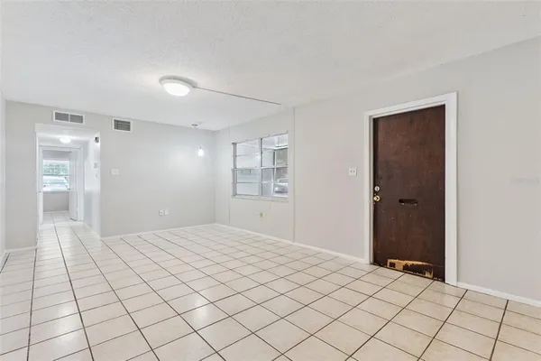 a view of an empty room and window