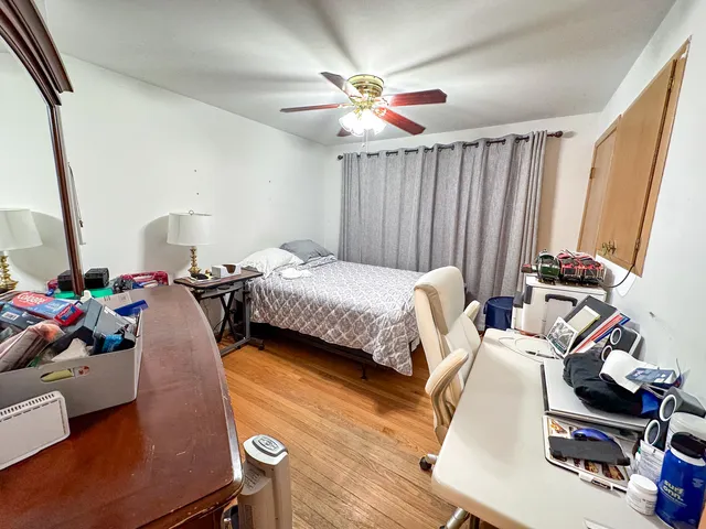 a bedroom with bed and a window