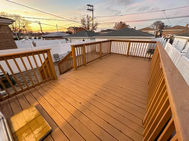 a balcony with view of wooden floor