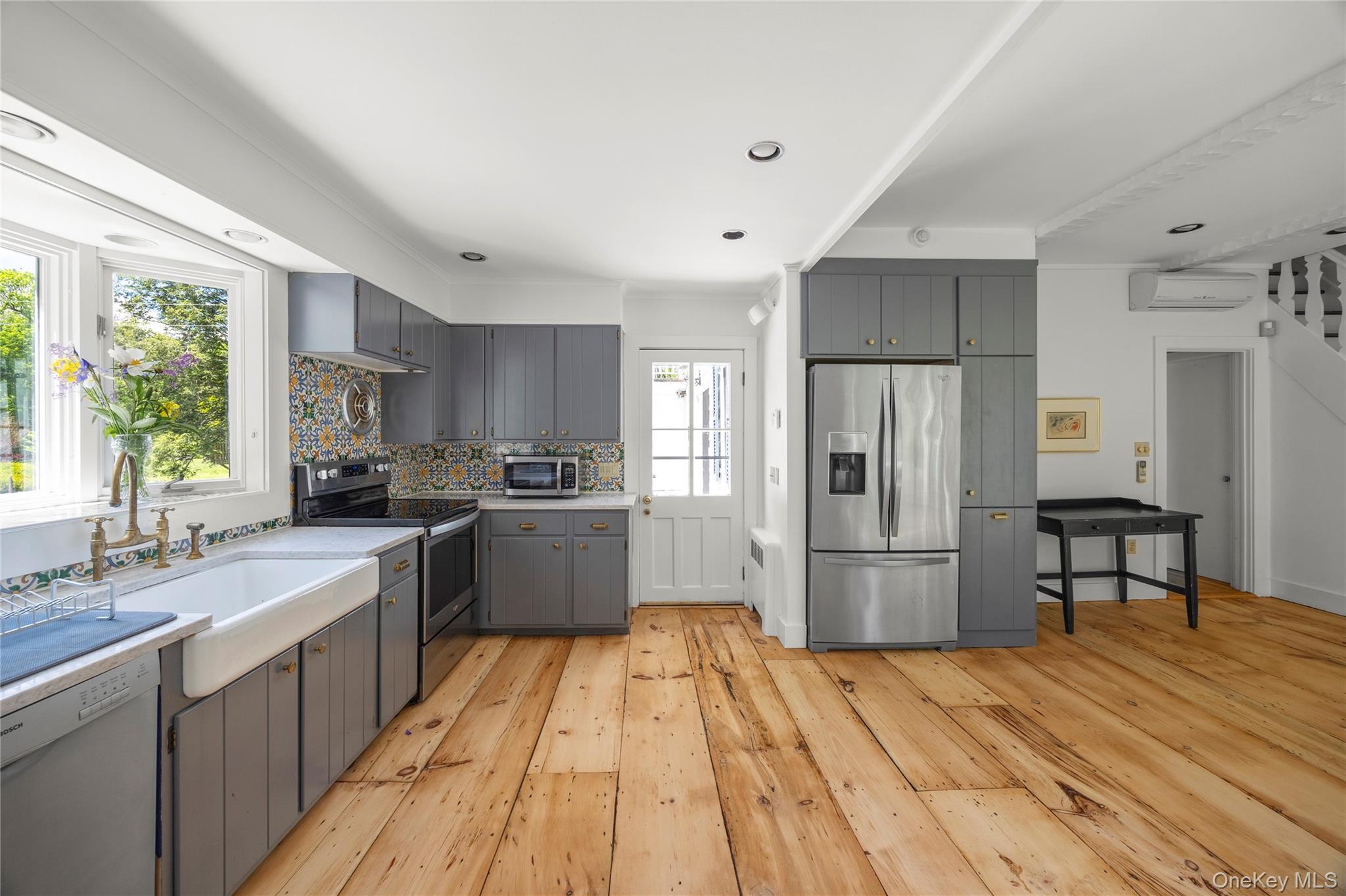202 Buckwheat Road Hudson, NY 12534 - Photo 13 of 49 a kitchen with a refrigerator a sink dishwasher and a stove with wooden floor