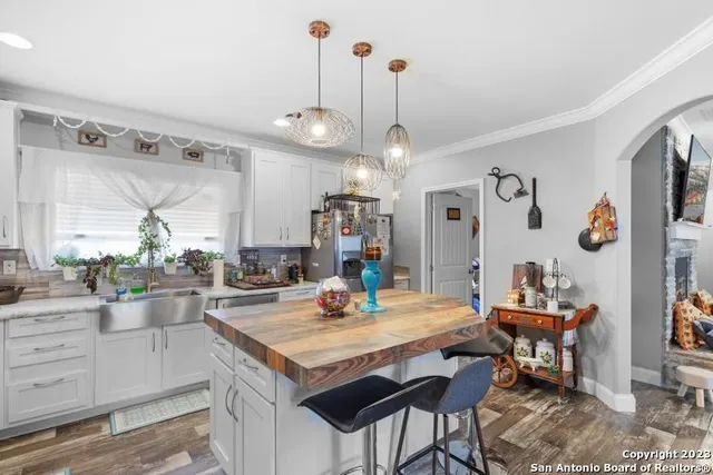 a kitchen with a dining table and chairs in it