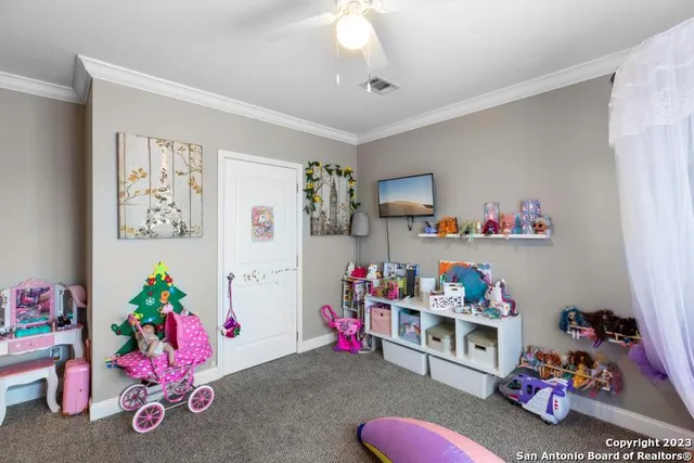 a bedroom with furniture and a window