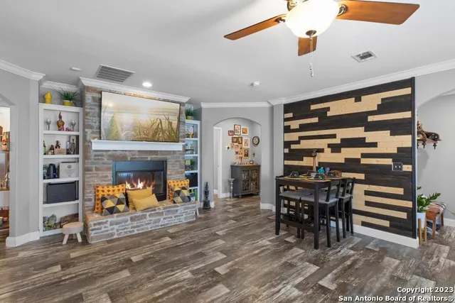 a view of a livingroom with furniture and a fireplace