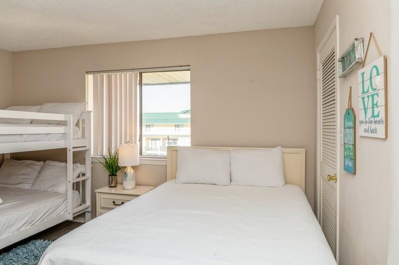 60 Sandprints Drive, Unit D2 Miramar Beach, FL 32550 - Photo 11 of 26 a bedroom with a bed and a window