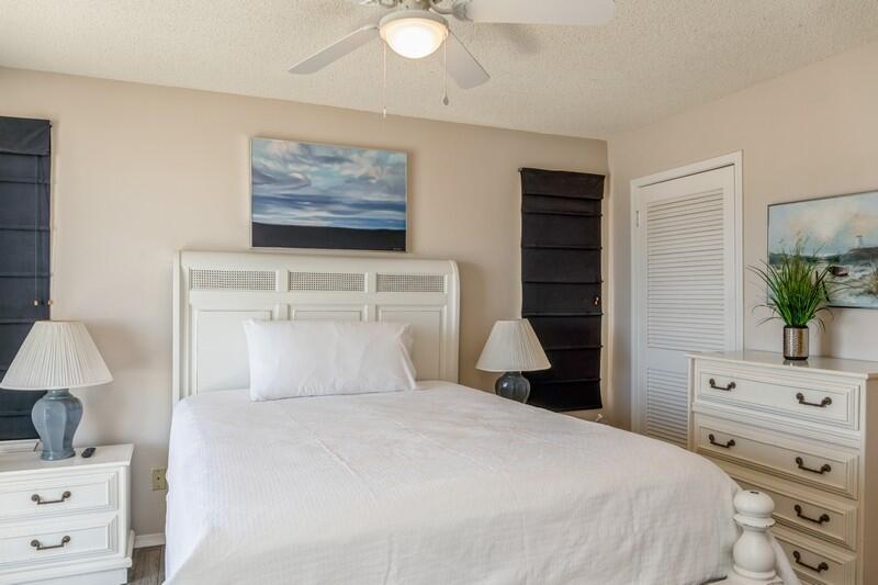60 Sandprints Drive, Unit D2 Miramar Beach, FL 32550 - Photo 14 of 26 a bedroom with a bed and a potted plant