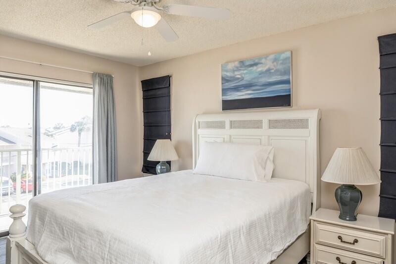 60 Sandprints Drive, Unit D2 Miramar Beach, FL 32550 - Photo 15 of 26 a bedroom with a large bed and a window