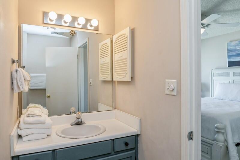60 Sandprints Drive, Unit D2 Miramar Beach, FL 32550 - Photo 17 of 26 a bathroom with a sink and a mirror