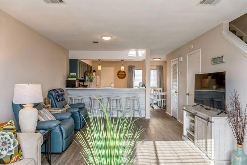 60 Sandprints Drive, Unit D2 Miramar Beach, FL 32550 - Photo 2 of 26 a living room with furniture and a flat screen tv