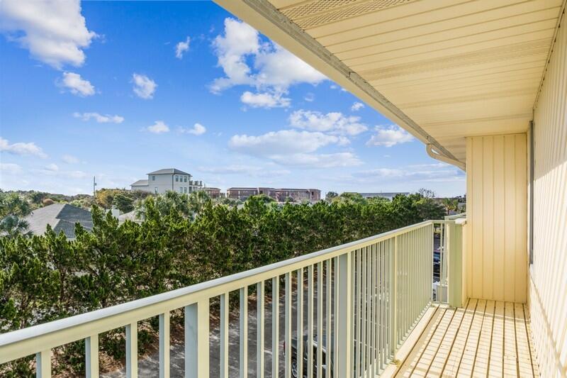 60 Sandprints Drive, Unit D2 Miramar Beach, FL 32550 - Photo 21 of 26 a balcony with trees in front of it