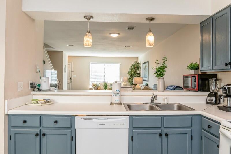60 Sandprints Drive, Unit D2 Miramar Beach, FL 32550 - Photo 8 of 26 a kitchen with a sink stainless steel appliances and cabinets