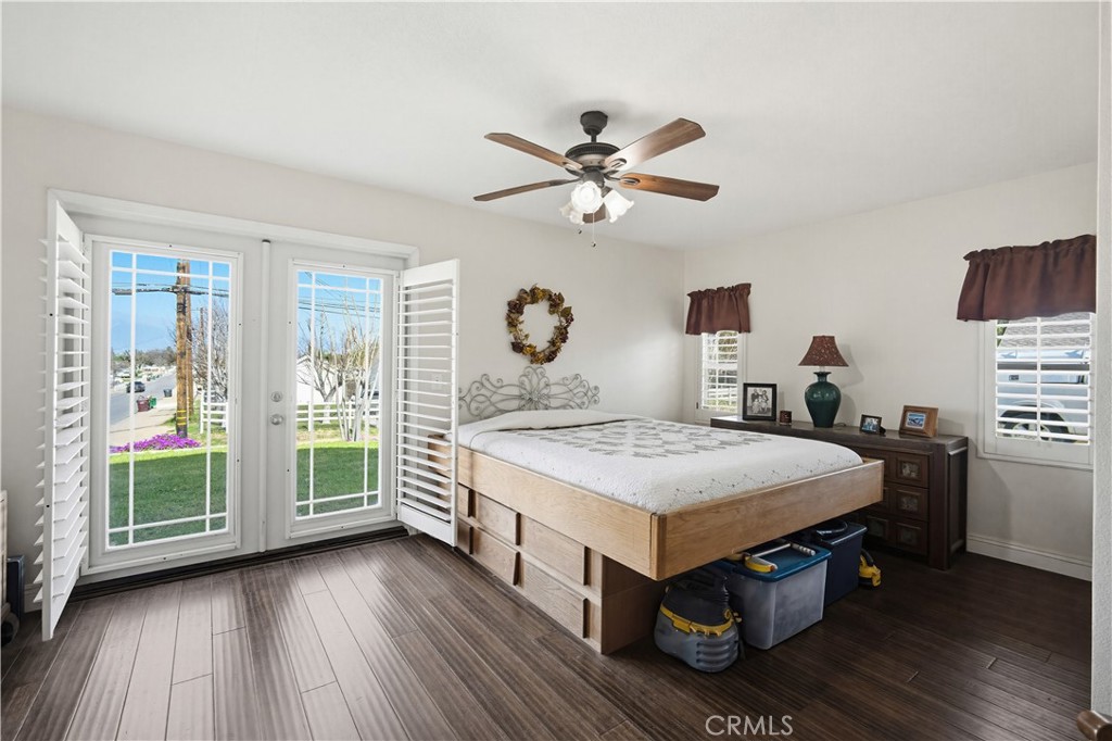 1090 Fourth Street Norco, CA 92860 - Photo 11 of 21 a bedroom with a bed and a chandelier