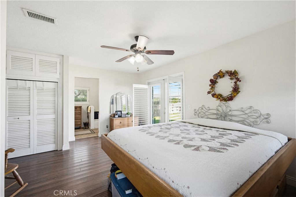 1090 Fourth Street Norco, CA 92860 - Photo 12 of 21 a bed sitting in a spacious bedroom next to a window
