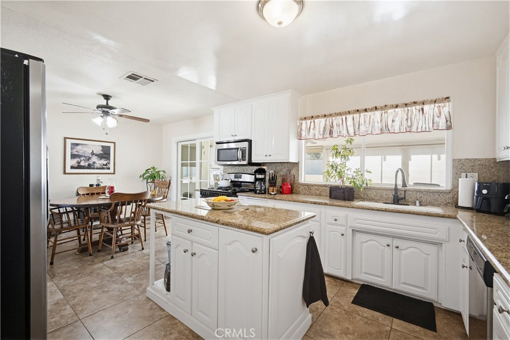1090 Fourth Street Norco, CA 92860 - Photo 4 of 21 a kitchen with sink cabinets and window