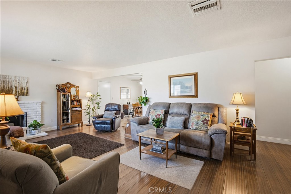 1090 Fourth Street Norco, CA 92860 - Photo 8 of 21 a living room with furniture and wooden floor