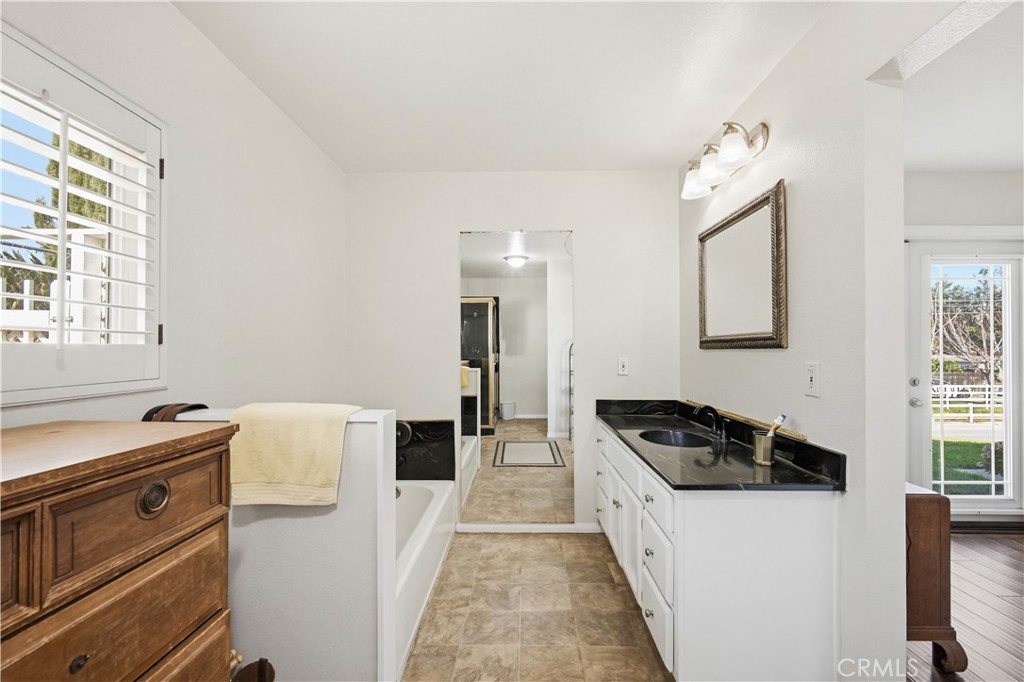 1090 Fourth Street Norco, CA 92860 - Photo 10 of 21 a kitchen with granite countertop a stove and a refrigerator