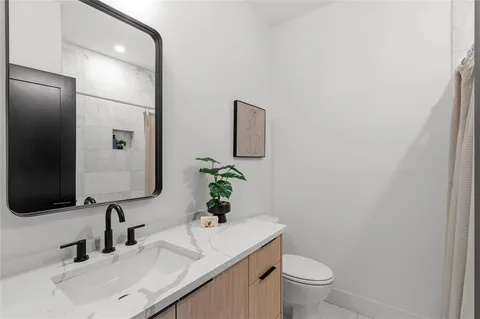 a picture of a bathroom with mirror
