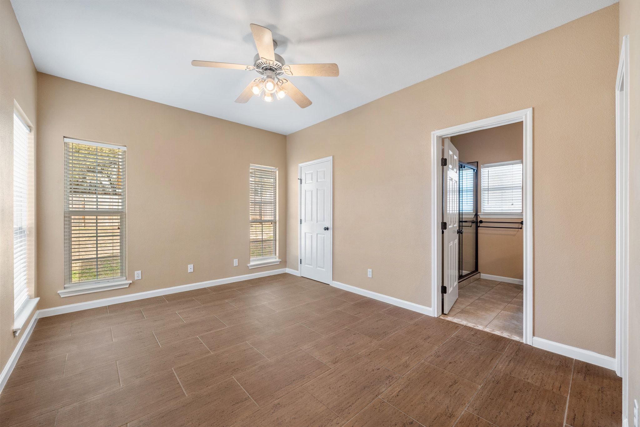 3139 Chisholm Trail Austin, TX 78734 - Photo 21 of 37 Unfurnished bedroom featuring a ceiling fan and wood finished floors