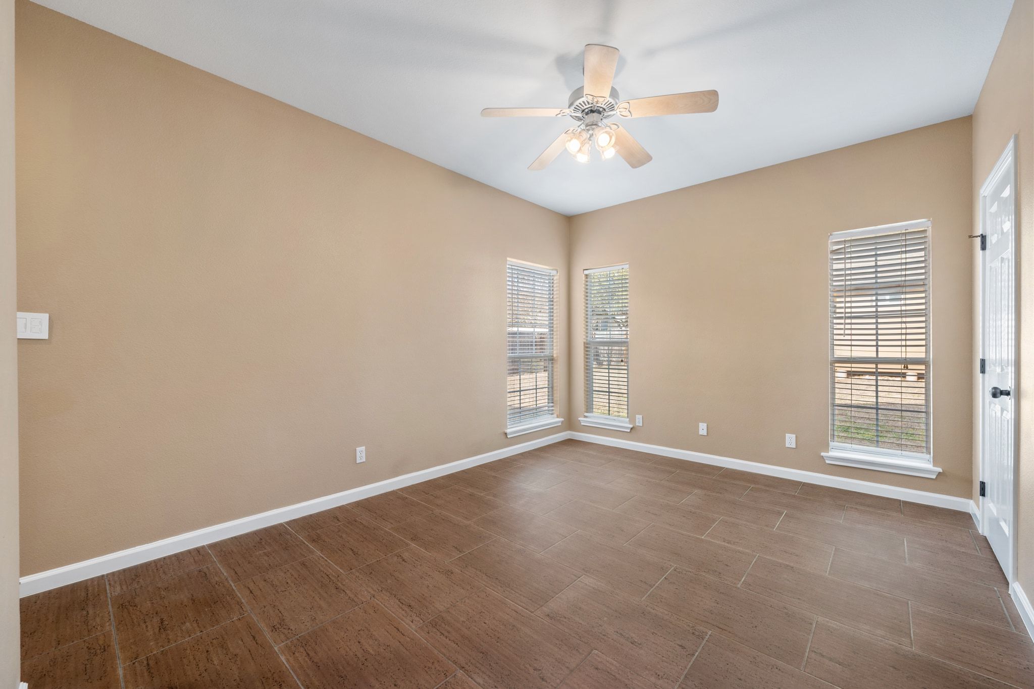 3139 Chisholm Trail Austin, TX 78734 - Photo 23 of 37 Spare room with ceiling fan and baseboards