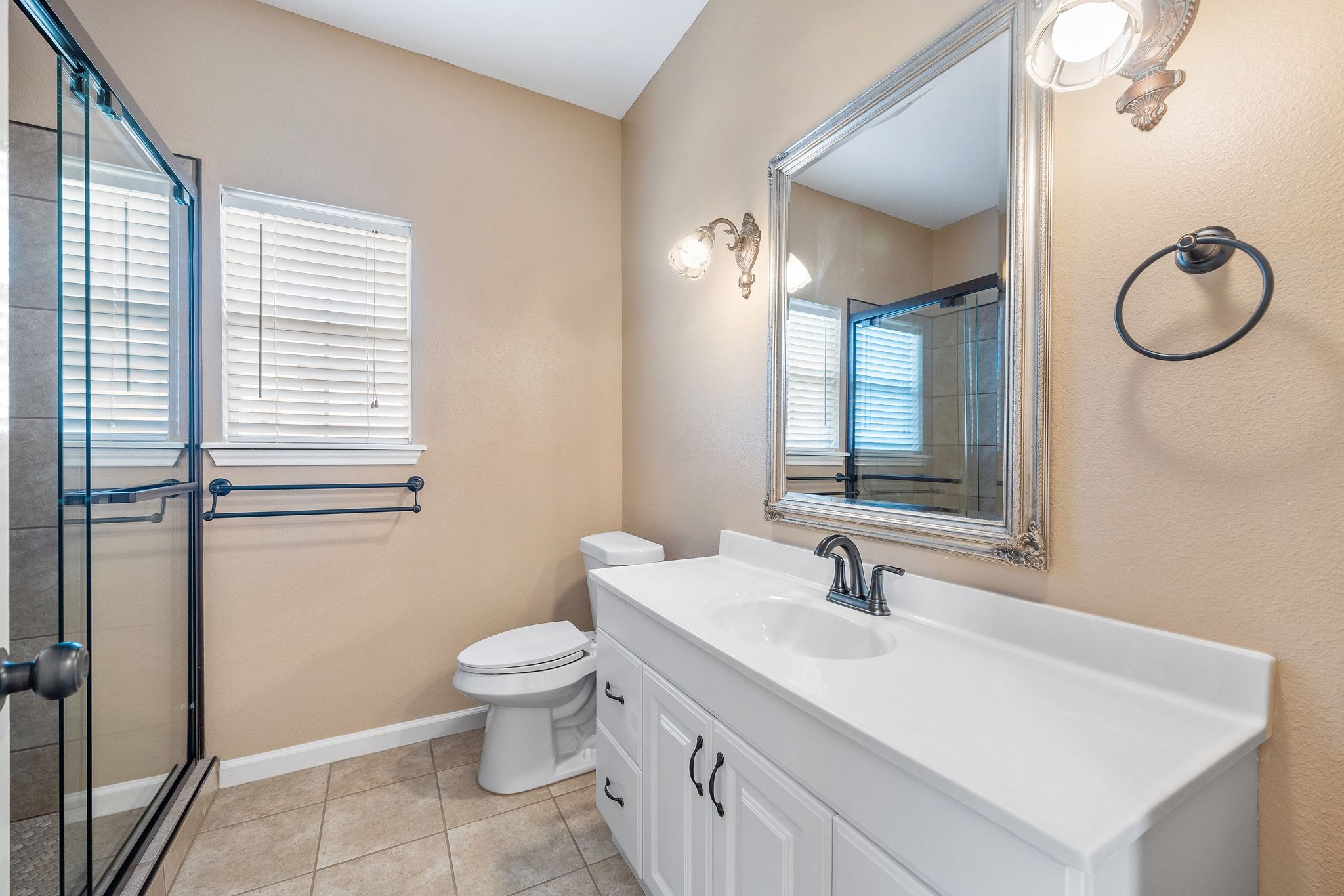 3139 Chisholm Trail Austin, TX 78734 - Photo 26 of 37 Bathroom featuring vanity, a shower stall, and light tile patterned floors